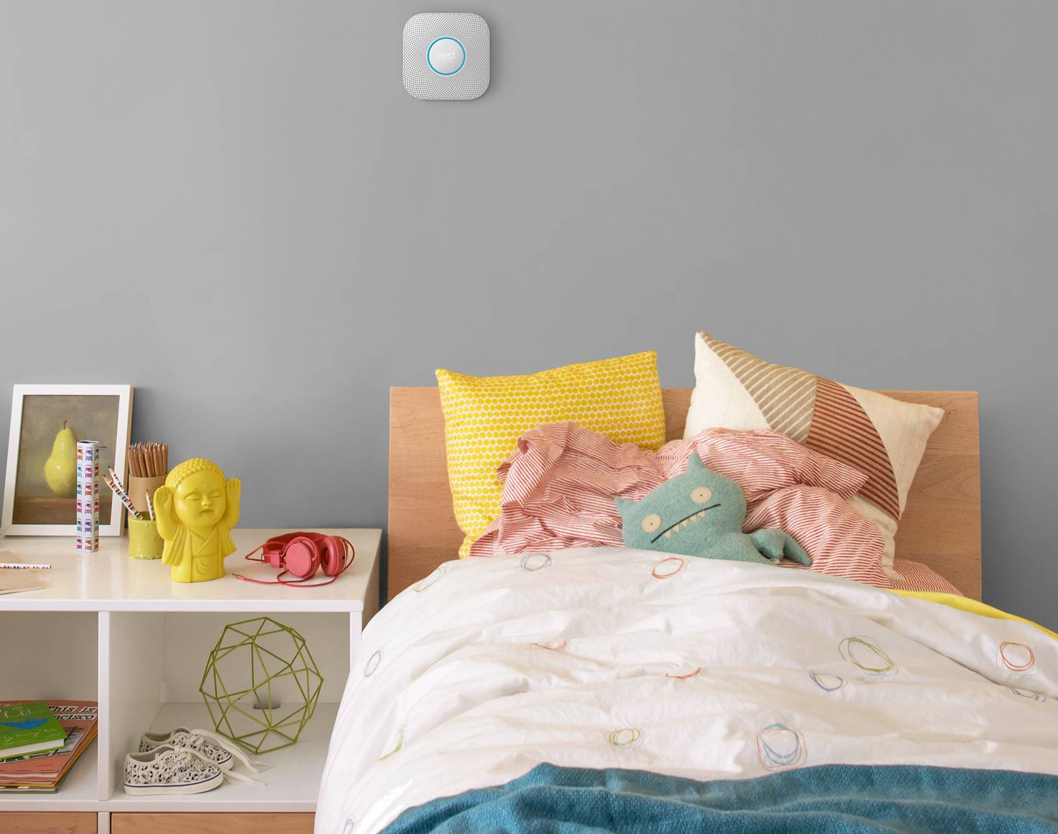 nest smoke detector on the wall in a child's bedroom