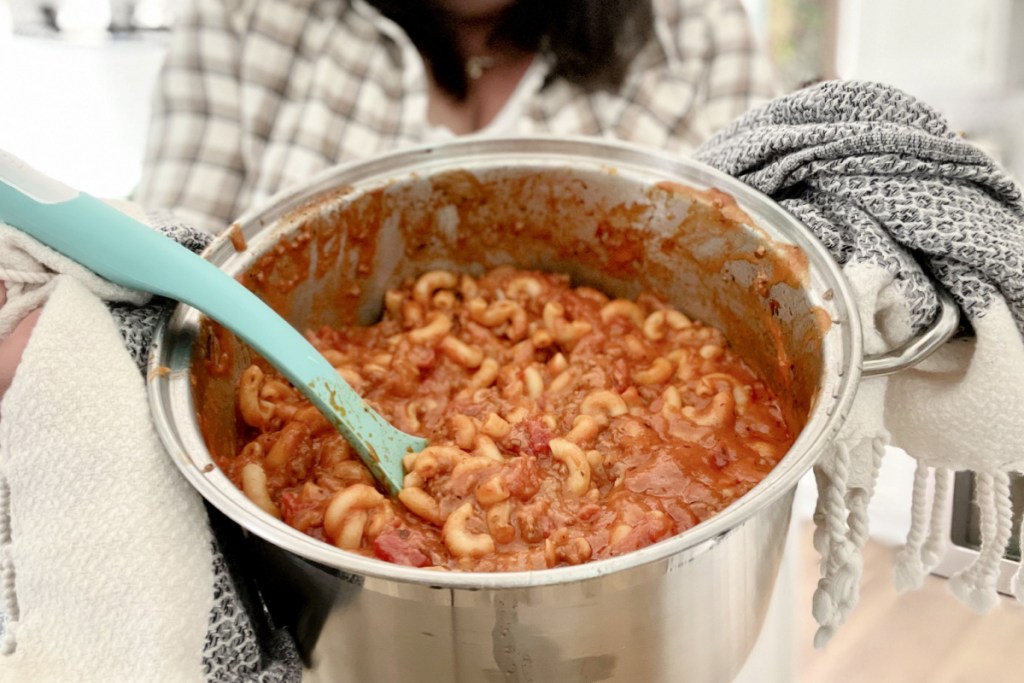 woman holding a bowl of homemade goulash