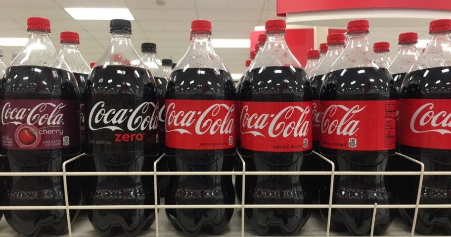 Coca Cola 2-liters in a row on shelf