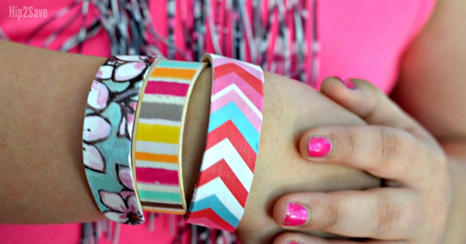 girl wearing wooden diy bracelets , one of the best Dollar Tree kids crafts and summer activities for kids
