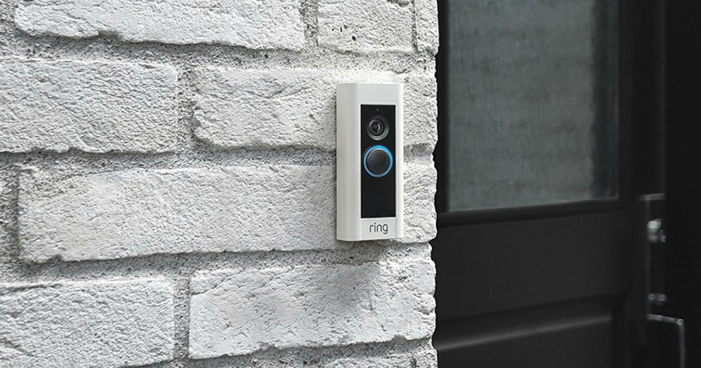 Ring Doorbell Pro on brick wall at front door of house