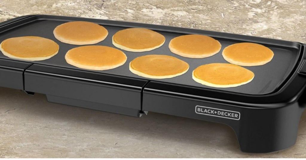 black griddle with pancakes cooking