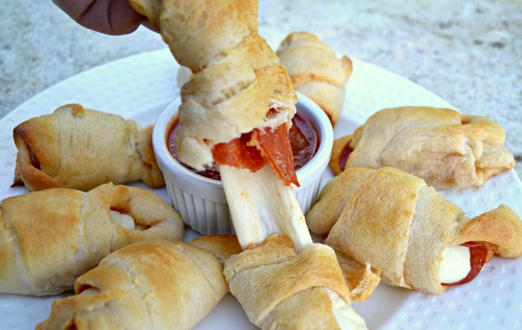 breaking apart melted pizza rolls