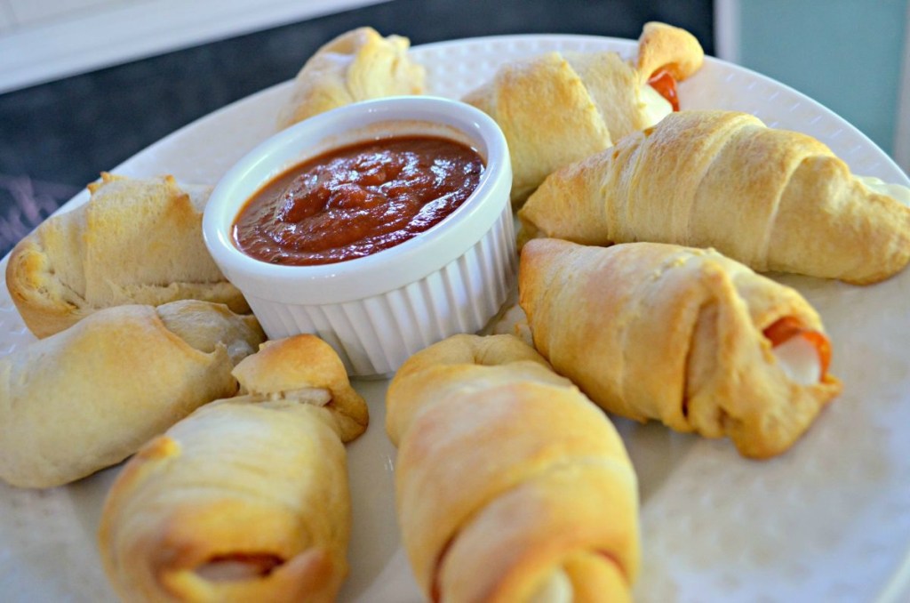 pizza crescents on a plate with marinara