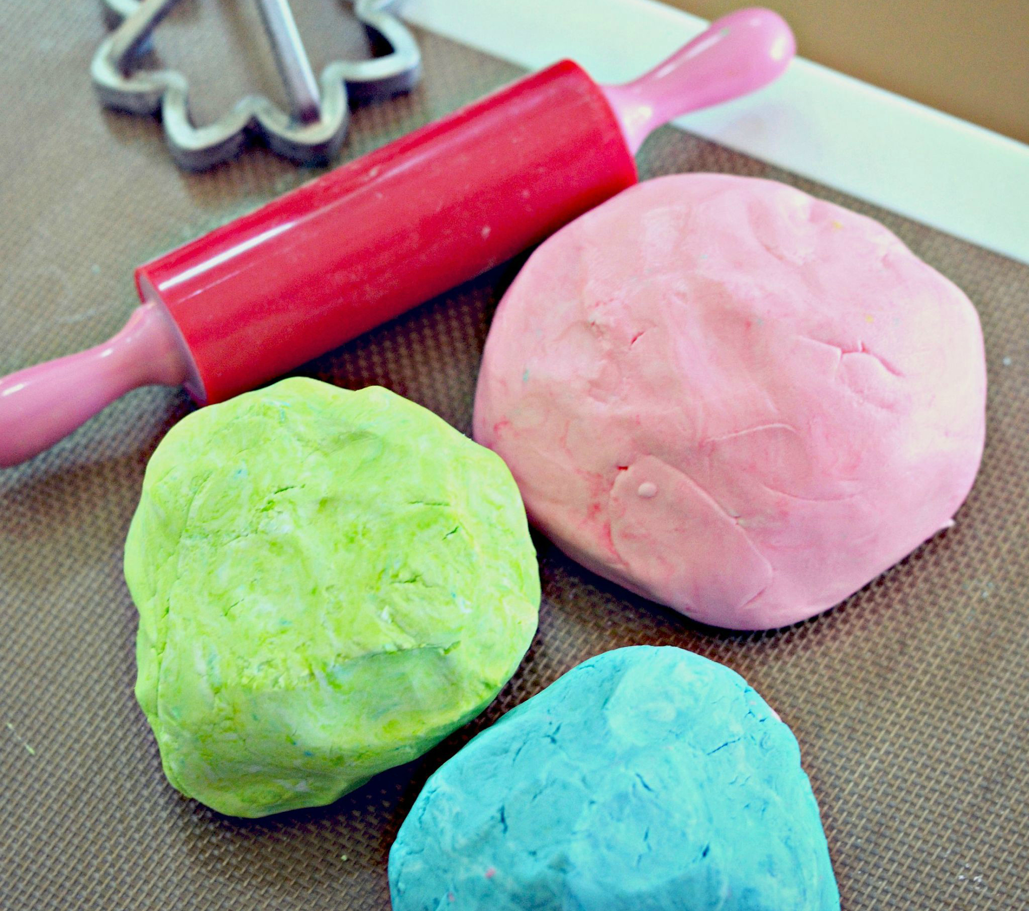 play doh in pink, blue, and green