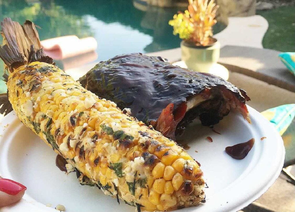 ribs and mexican corn on a plate
