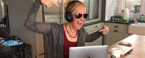 woman rocking out to music