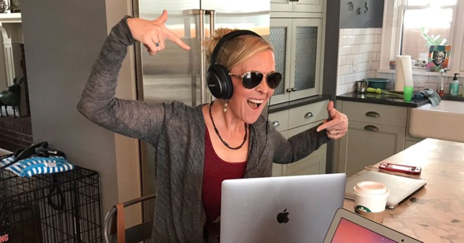 woman rocking out to music