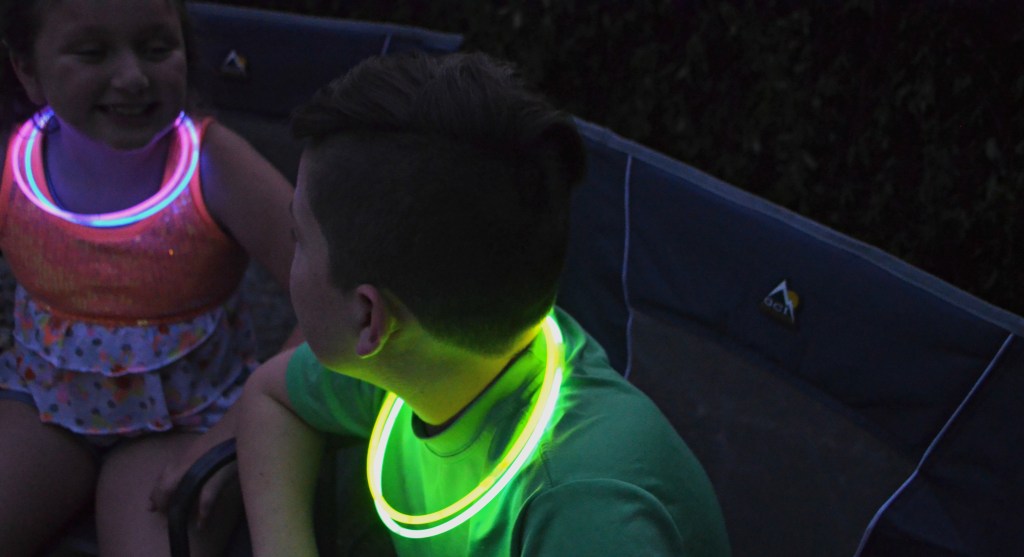 kids wearing glow stick necklaces
