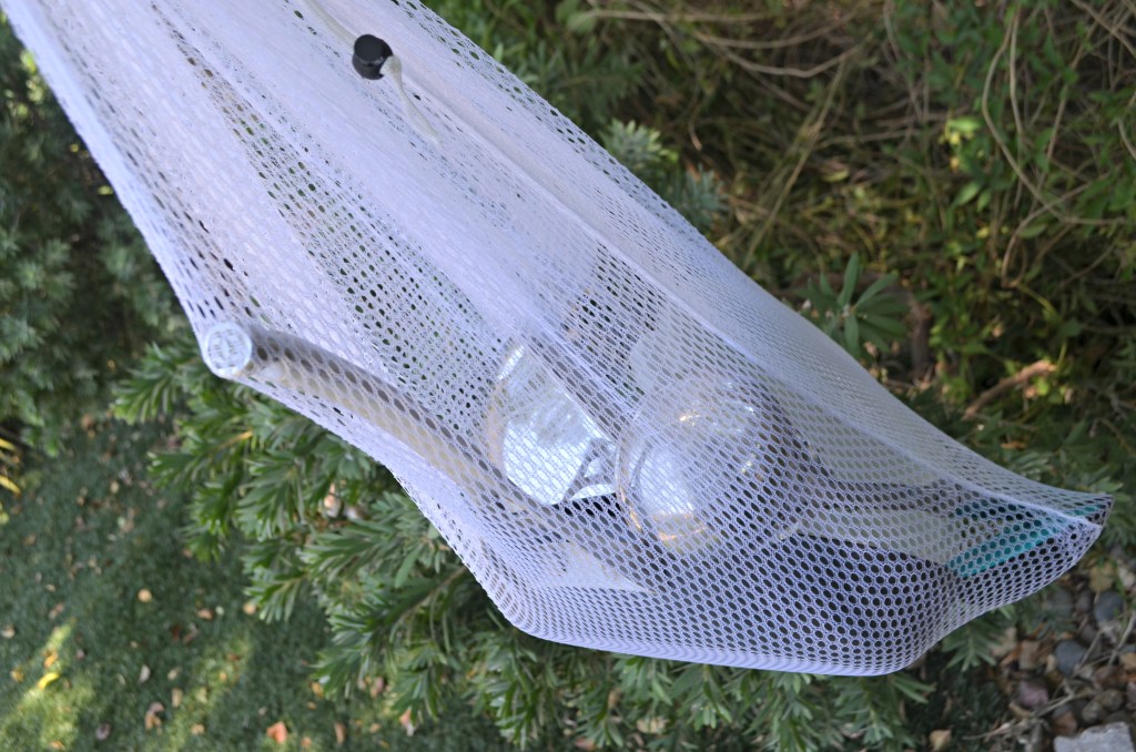 mesh laundry bag with cooking utensils camping hack