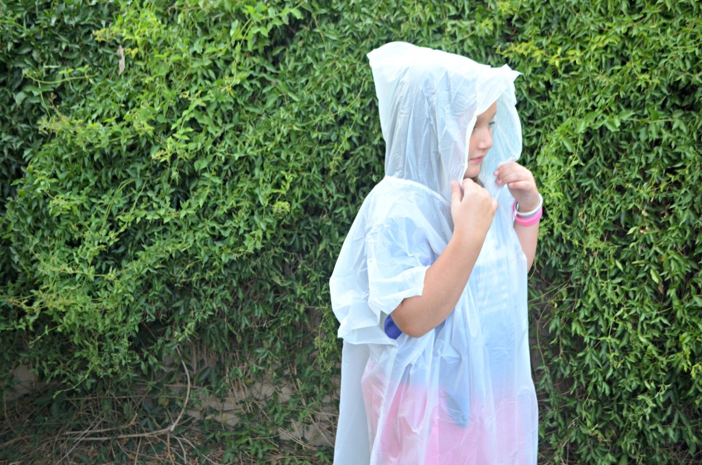 young girl wearing rain poncho