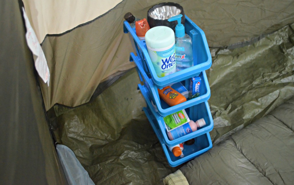 camping hacks - stacking organization bins in tent