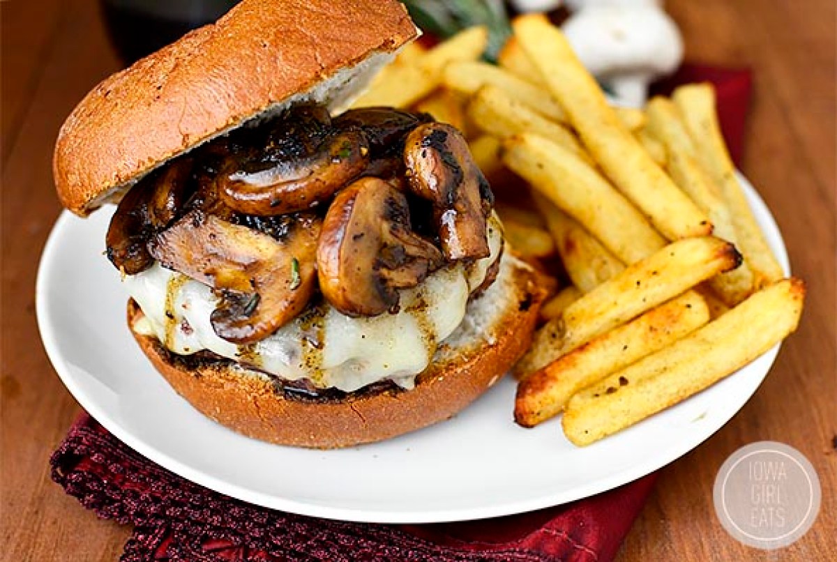 homemade burger topped with mushrooms and cheese