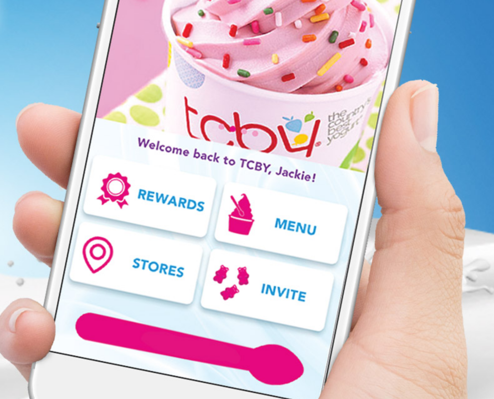 Hand holding smart phone open to the TCBY app