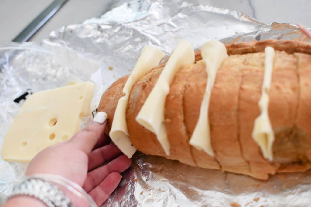 sliced swiss cheese to french bread