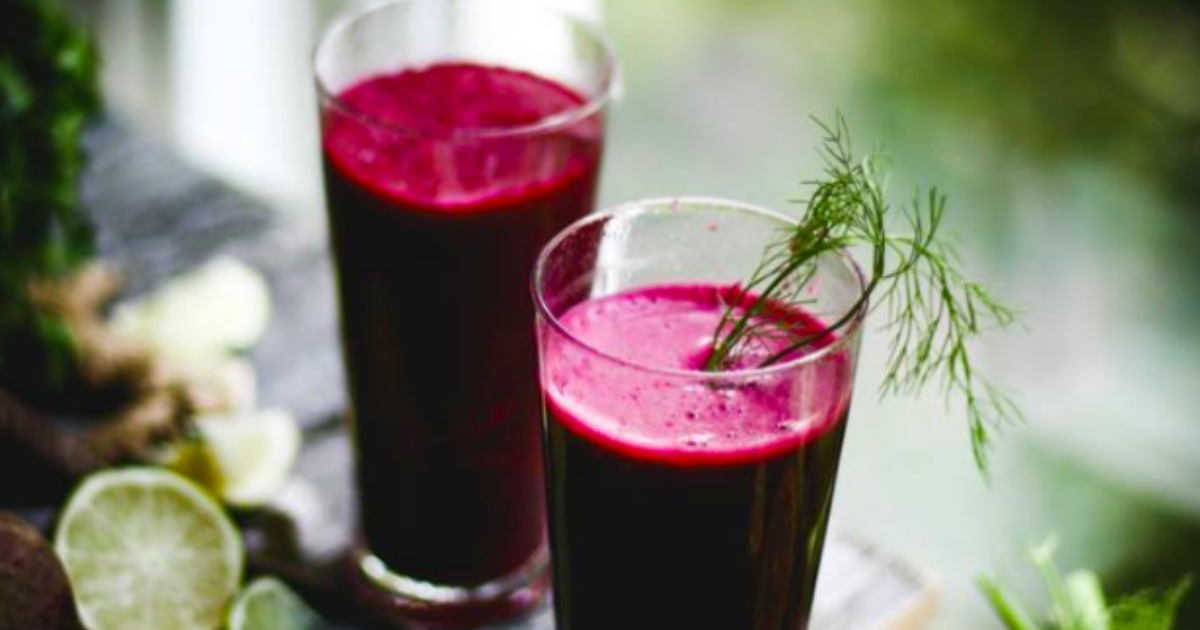 beet smoothies with herbs as garnish