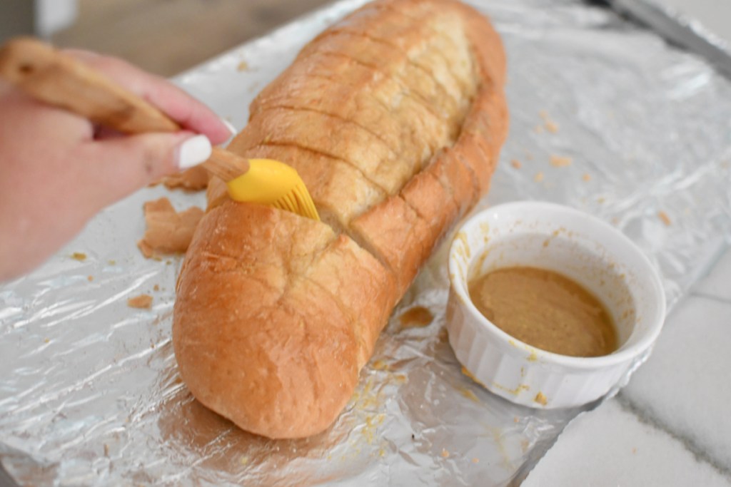 coating bread with butter mustard sauce