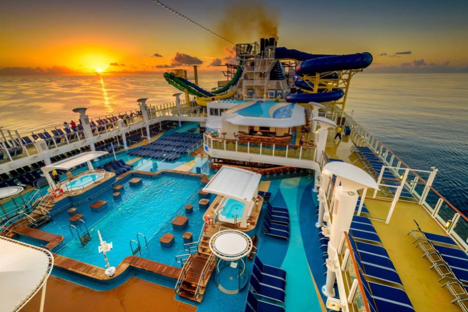 sunset in background of a cruise ship