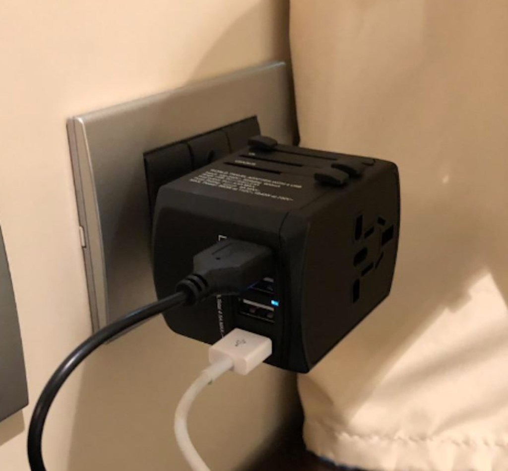 black power adapter and cords in wall