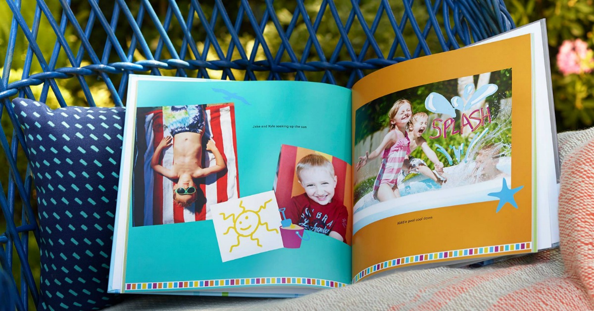 Shutterfly picture book open and filled with pictures, sitting in an outdoor wicker type chair on a cushion.