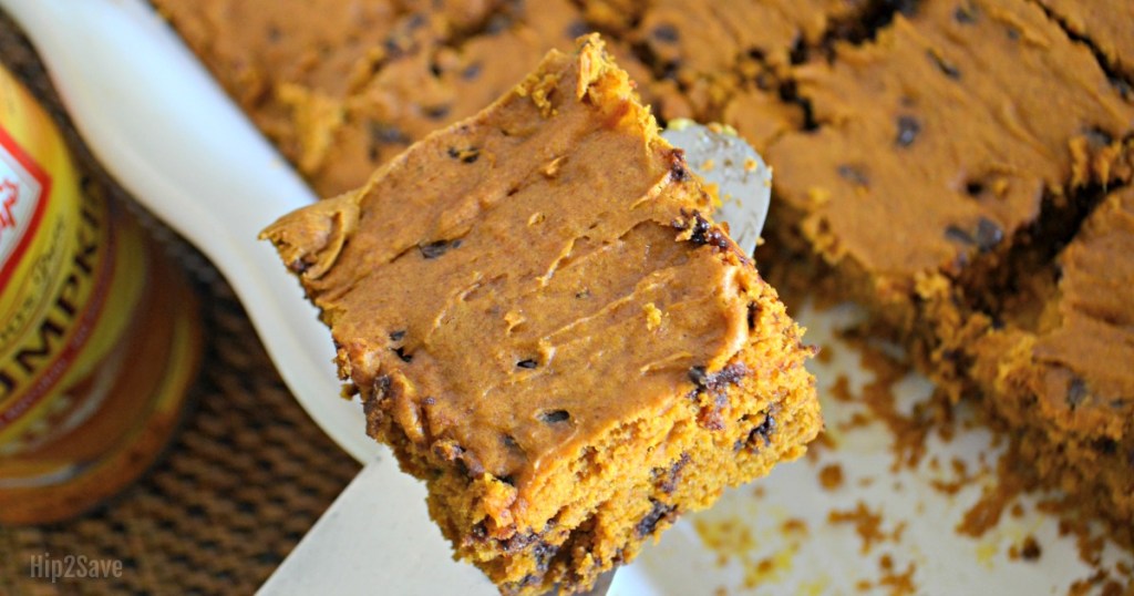 lifting out chocolate chip pumpkin square from pan