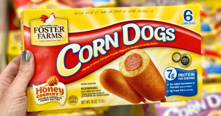 hand holding foster farms corn dogs box
