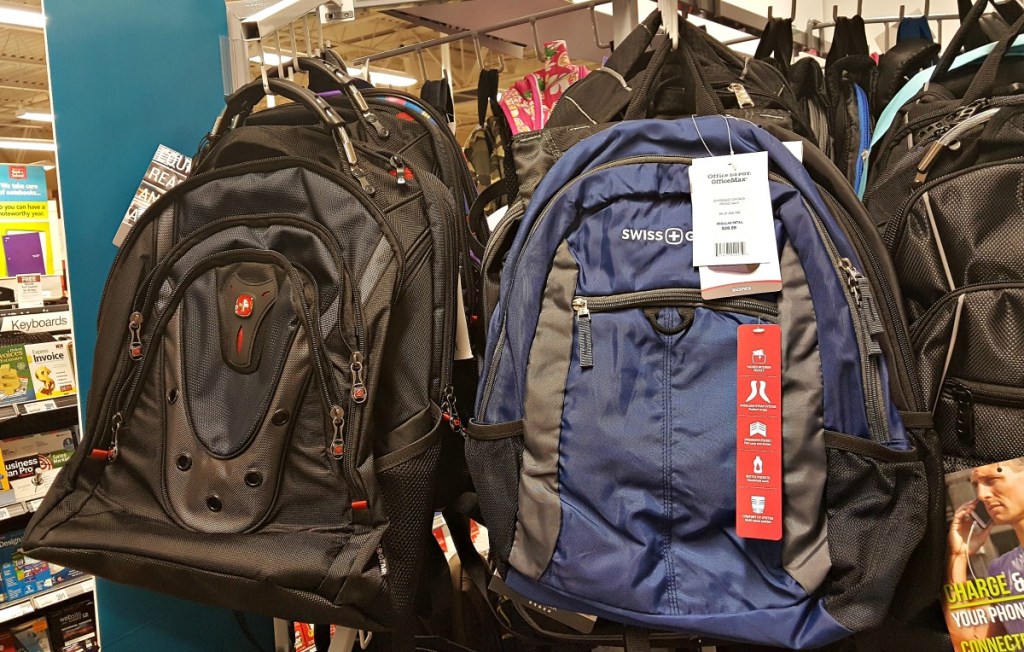black and navy blue backpack hanging on rack 