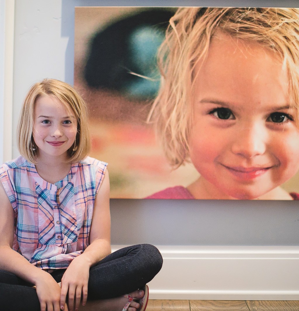 little girl sitting by canvas print 