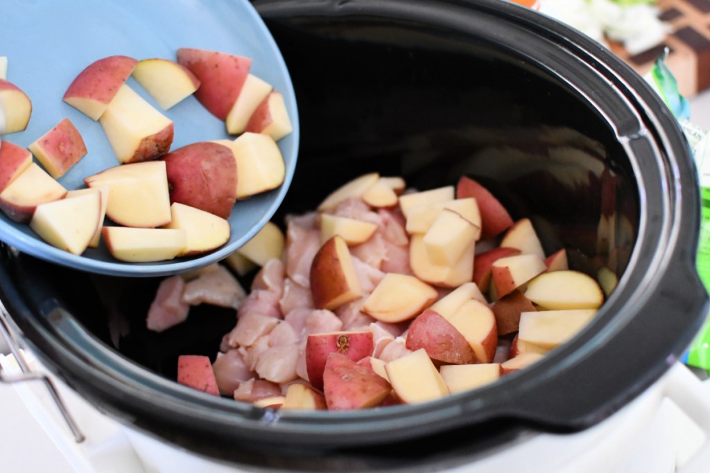 cut up potatoes with chicken in slow cooker 
