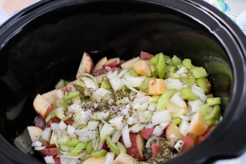 ingredients inside slow cooker for chicken pot pie soup