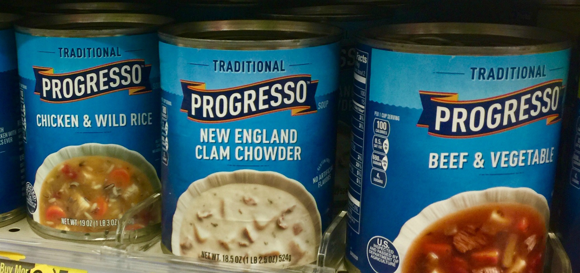 Progresso chicken & wild rice, Progresso new england clam chowder and progresso beef & vegetables soup on shelf in store