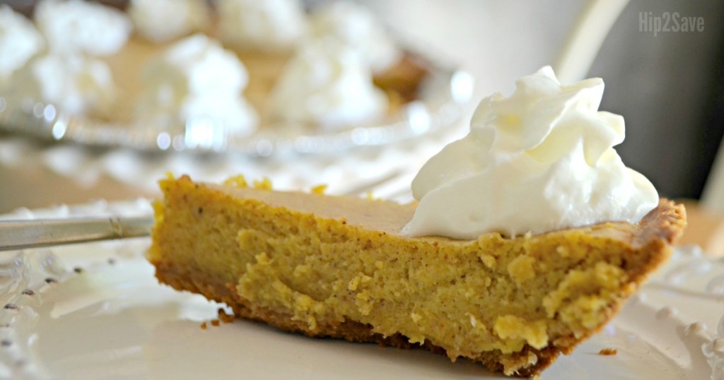 pumpkin pie on plate with whipped cream