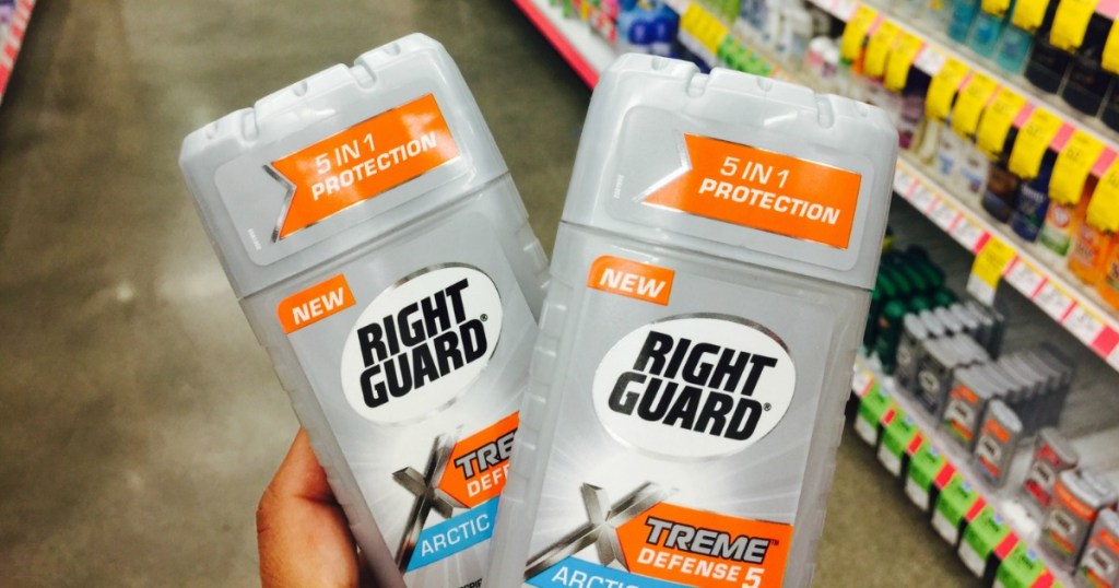 hand holding two Right Guard Xtreme Walgreens