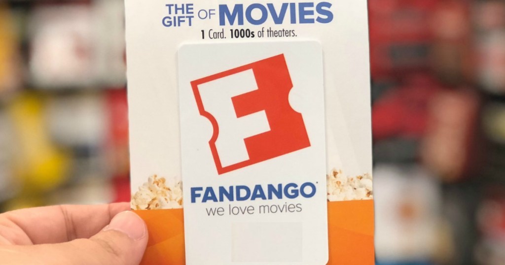 Fandango Gift Card held up in front of gift card display