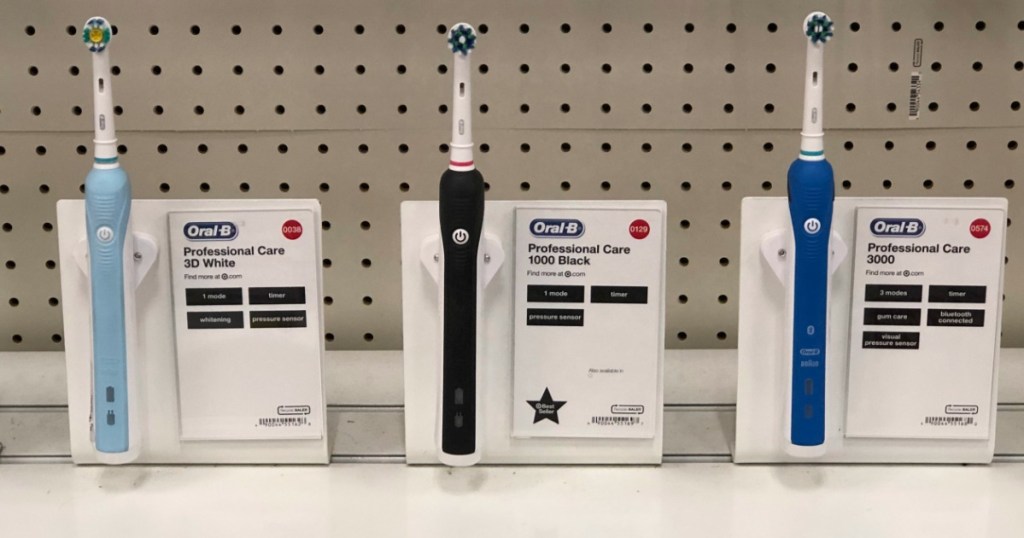 blue, black and navy blue oral be toothbrushes on store shelf