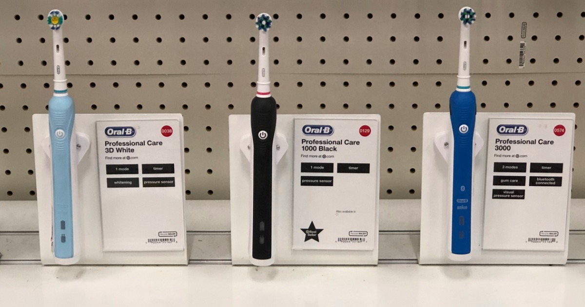 blue, black and navy blue oral-b toothbrushes on store shelf