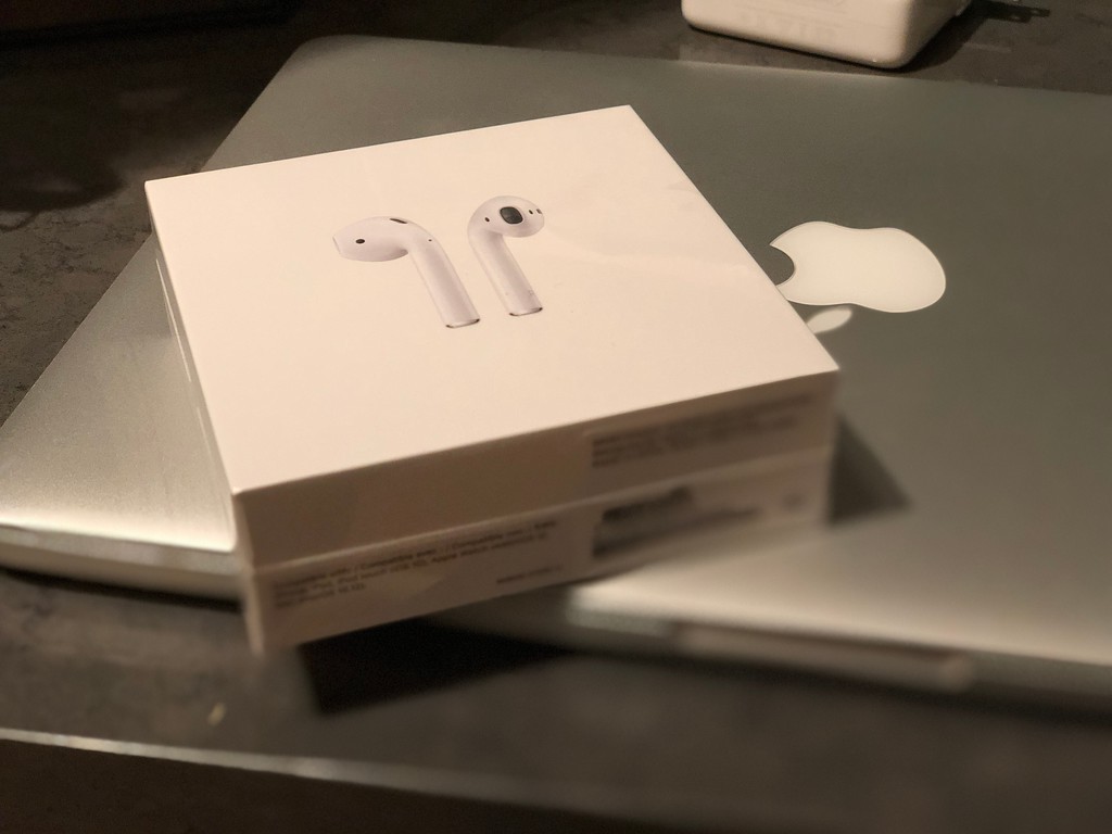 Apple airpods in a case on a computer!
