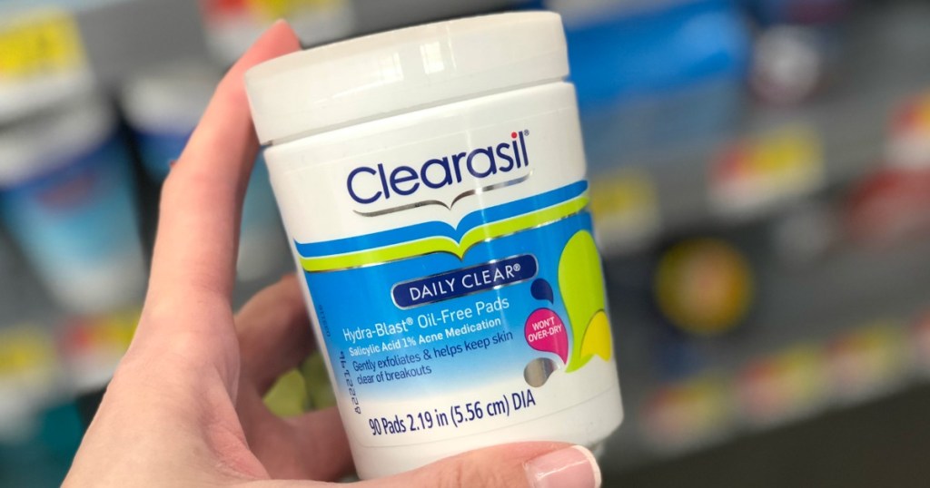 hand holding clearasil pads