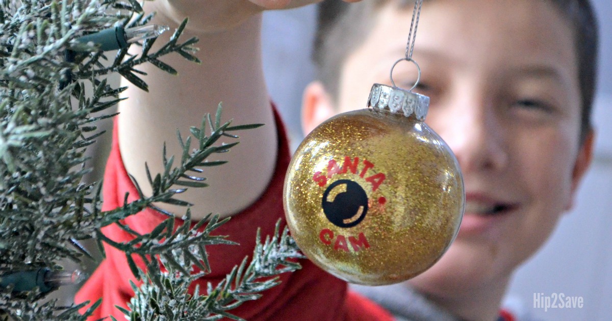 boy holding up diy christmas ornament