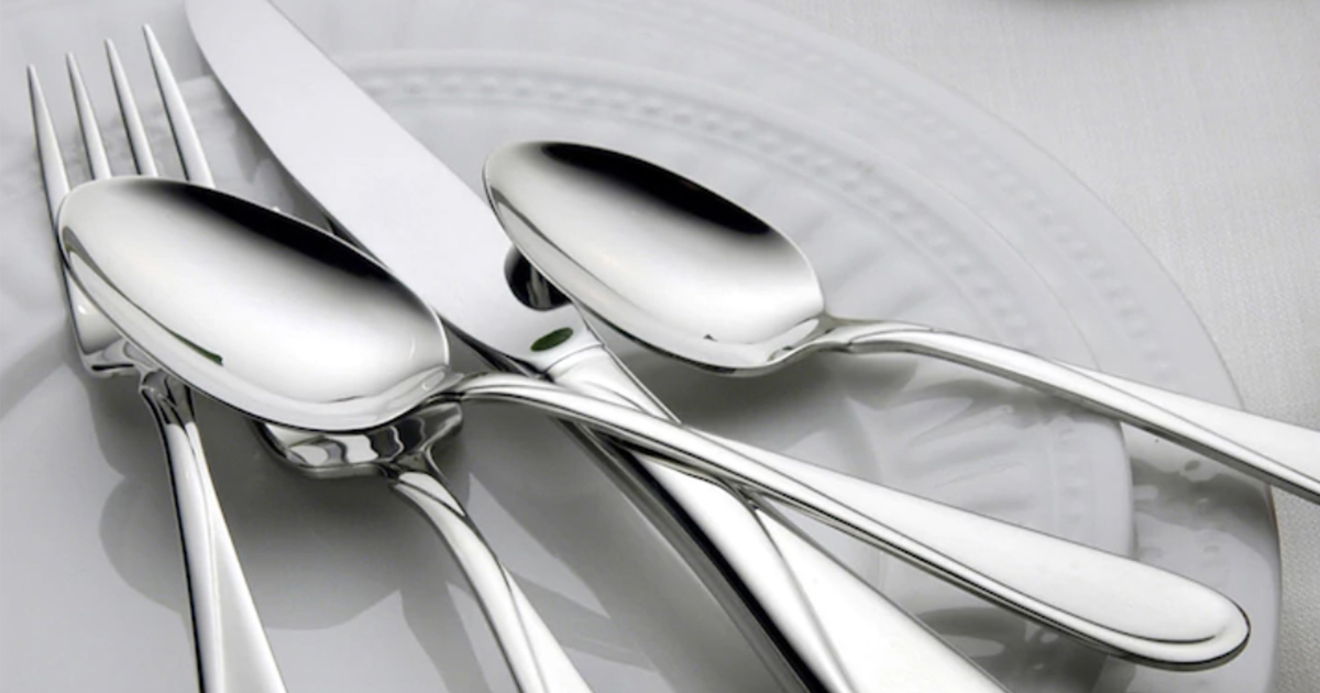 up close photo of silverware a fork, spoons, knife on a plate