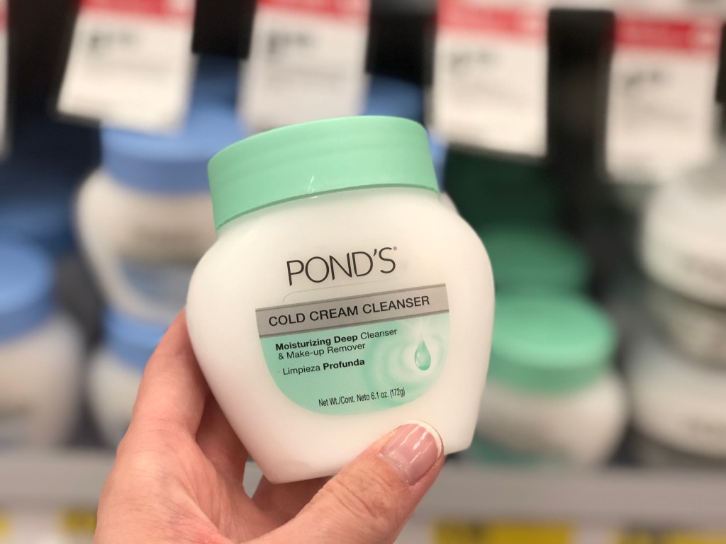 hand holding Pond's Cold Cream Cleanser