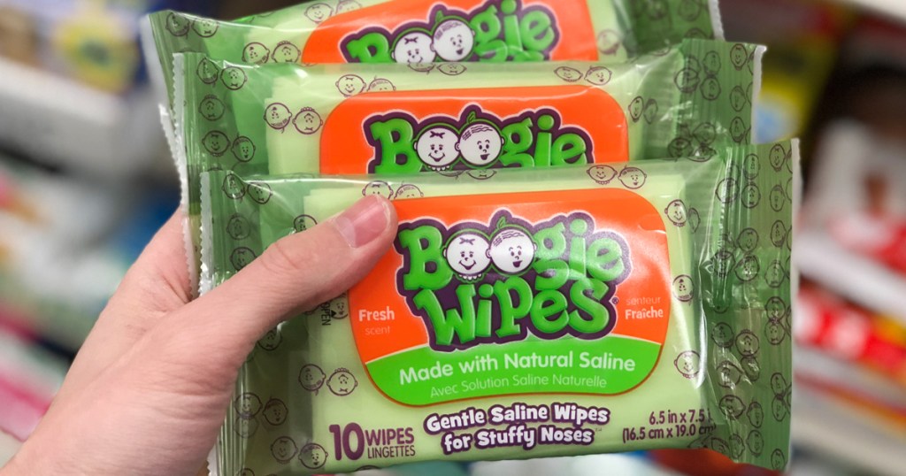 hand holding three green packs of infant nose wipes