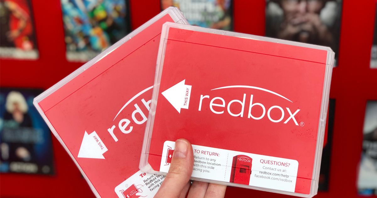 hand holding Redbox movies