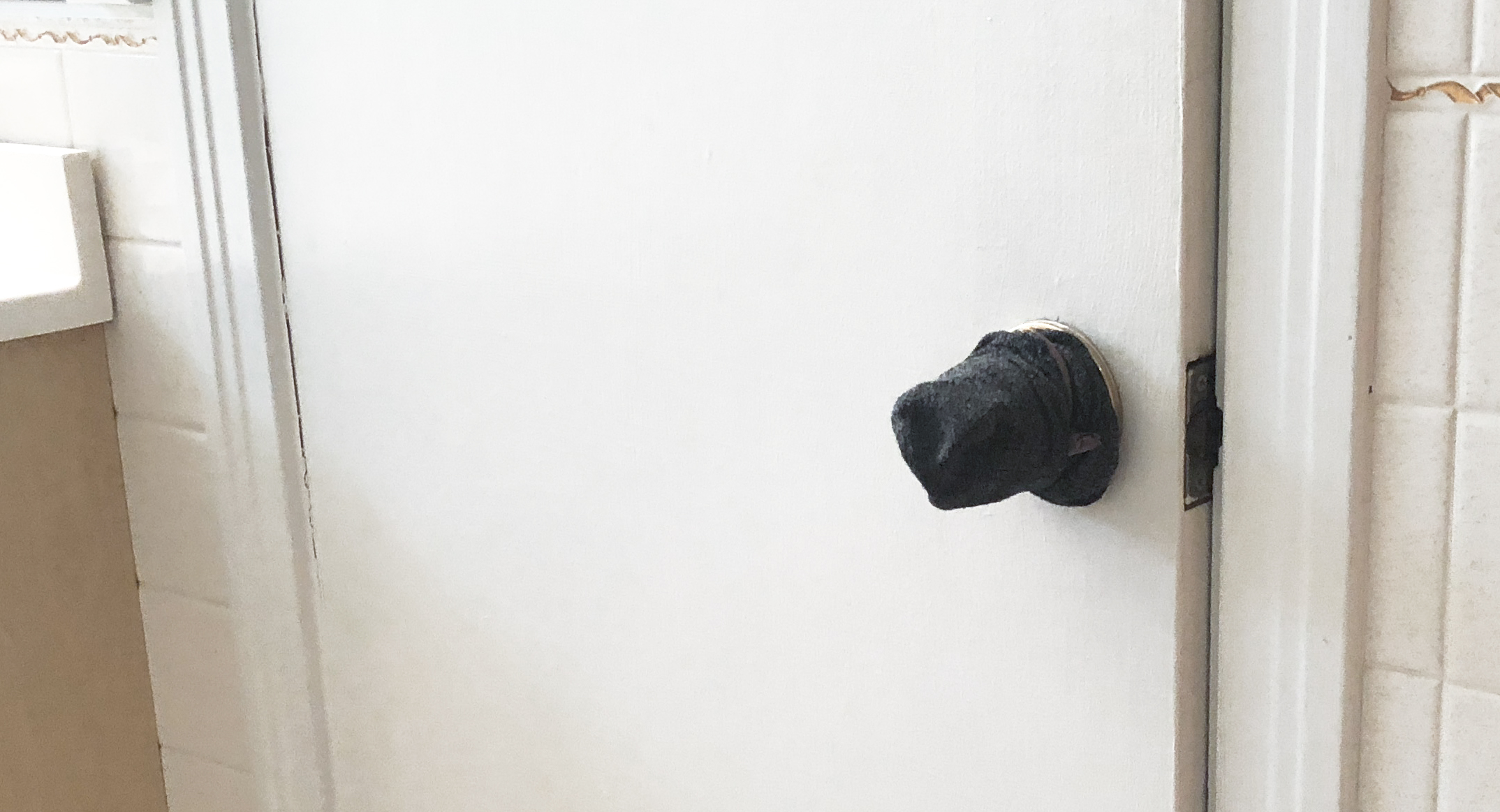cover doorknobs with socks to prevent them from being opened