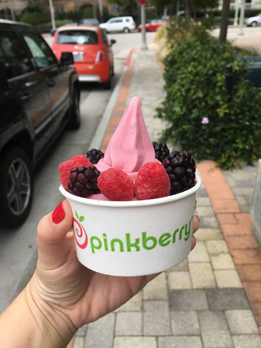 Pinkberry frozen yogurt in a cup with berries
