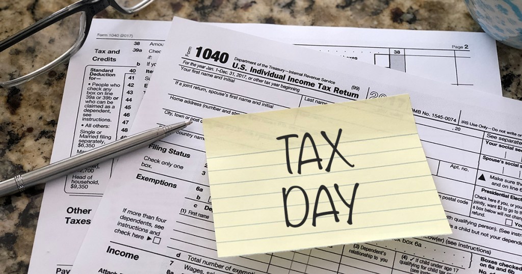 tax day paperwork with pencil on counter