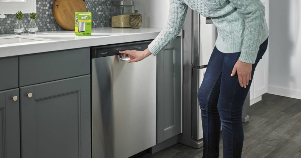 woman using Affresh Dishwasher Cleaner