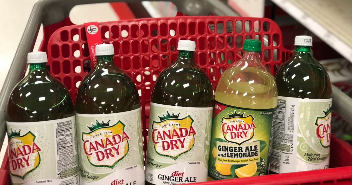 canada dry 2L bottles in a row in a shopping cart
