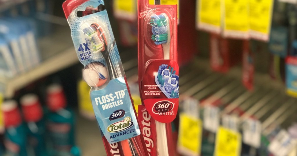two Colgate toothbrushes
