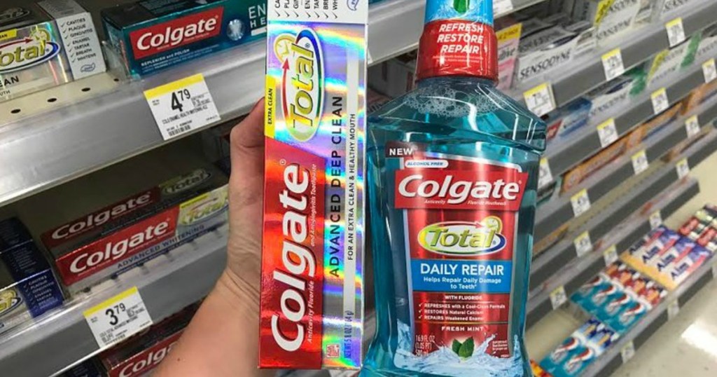 hand holding colgate total advanced deep clean toothpaste daily repair mouthwash walgreens